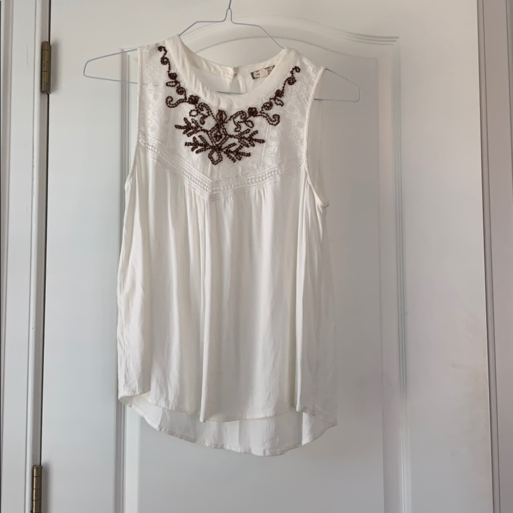 White blouse with copper flowering at the top